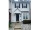 Charming townhome featuring classic black shutters and a well-maintained landscaped yard at 5650 Kimmerly Woods Dr, Charlotte, NC 28215