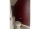 A cozy half bathroom featuring a toilet and decorative wall paint at 5650 Kimmerly Woods Dr, Charlotte, NC 28215