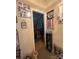 Hallway leading to bedroom, decorated with Gathering photos and mementos adding character at 5650 Kimmerly Woods Dr, Charlotte, NC 28215