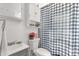 Well-lit bathroom featuring a sink, toilet, and a shower with a stylish checkered curtain at 727 Fickling Dr, Lancaster, SC 29720