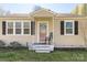 Charming front porch with a decorative wreath and inviting rocking chair at 727 Fickling Dr, Lancaster, SC 29720