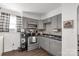 Updated kitchen featuring grey cabinets, stainless steel appliances, and modern lighting at 727 Fickling Dr, Lancaster, SC 29720