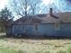 Side view of the property showing the blue siding and chimney at 922 Marshville Olive Branch Rd, Marshville, NC 28103