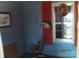 Image of a room with blue walls and red shutters on the window at 922 Marshville Olive Branch Rd, Marshville, NC 28103