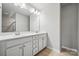 Bathroom featuring a double vanity with a large mirror and great lighting at 10036 Brittondale Ln, Charlotte, NC 28215