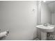 Bathroom with a pedestal sink, chrome fixtures, and neutral wall color at 10036 Brittondale Ln, Charlotte, NC 28215