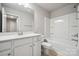 Bathroom featuring vanity, toilet, and shower-tub combo at 10036 Brittondale Ln, Charlotte, NC 28215