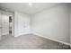 Neutral bedroom with carpet, double door closet and modern finishes at 10036 Brittondale Ln, Charlotte, NC 28215
