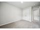 Neutral bedroom with carpet, closet, and modern finishes at 10036 Brittondale Ln, Charlotte, NC 28215