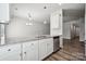 Open kitchen with granite countertops, stainless steel appliances, and wood flooring at 10036 Brittondale Ln, Charlotte, NC 28215