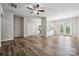 A spacious living room featuring a ceiling fan and seamless connection to the kitchen and dining area at 10036 Brittondale Ln, Charlotte, NC 28215
