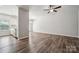 A spacious living room featuring a ceiling fan and seamless connection to the kitchen and dining area at 10036 Brittondale Ln, Charlotte, NC 28215