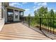 Large wooden back deck offers picturesque views of the backyard and surrounding greenery at 10421 Superb Ln, Charlotte, NC 28215
