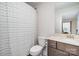 Cozy bathroom with a mirror, a toilet and a white-patterned curtain at 10421 Superb Ln, Charlotte, NC 28215