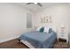 Bright bedroom featuring a cozy bed with stylish pillows and white nightstands with lamps at 10421 Superb Ln, Charlotte, NC 28215
