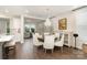 Cozy dining area featuring chandelier lighting, seamlessly connecting to the kitchen and living areas at 10421 Superb Ln, Charlotte, NC 28215