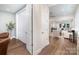 Bright entryway featuring wood floors, coat closet and an open view to the living room at 10421 Superb Ln, Charlotte, NC 28215