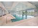 Bright and spacious indoor pool with large windows and ample natural light at 10421 Superb Ln, Charlotte, NC 28215