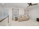 Comfortable living room featuring a cozy couch, and bright, natural lighting at 10421 Superb Ln, Charlotte, NC 28215