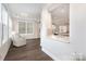Spacious living room with lots of natural light flowing into an open floor plan home at 10421 Superb Ln, Charlotte, NC 28215