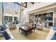 Bright community lounge area with high ceilings, a bar, comfortable seating, and elegant decor at 10421 Superb Ln, Charlotte, NC 28215