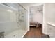 Luxury main bathroom featuring a large glass shower, tiled walls, and a view into the main bedroom at 10421 Superb Ln, Charlotte, NC 28215