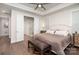 Bright main bedroom featuring an ensuite bathroom, hardwood floors, and large windows at 10421 Superb Ln, Charlotte, NC 28215