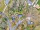 An aerial view of a neighborhood with mature trees, and well-maintained homes at 107 Wedgewood Ne Cir, Concord, NC 28025