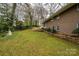 Expansive backyard with lush green grass and mature trees, offering a private outdoor space at 107 Wedgewood Ne Cir, Concord, NC 28025