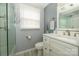 Bathroom featuring grey walls, modern vanity, and a well-lit mirror at 107 Wedgewood Ne Cir, Concord, NC 28025