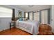 Bedroom featuring hardwood floors and ample closet space at 107 Wedgewood Ne Cir, Concord, NC 28025