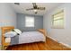 This bedroom features hardwood flooring, bright natural lighting, and ceiling fan at 107 Wedgewood Ne Cir, Concord, NC 28025