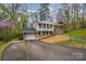 Charming home with a well-manicured lawn and a driveway, showcasing curb appeal at 107 Wedgewood Ne Cir, Concord, NC 28025