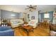Open floor plan from the living room leads into kitchen and dining space with hardwood floors at 107 Wedgewood Ne Cir, Concord, NC 28025