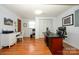 Home office with hardwood floors, a built-in desk, and natural light for a productive workspace at 107 Wedgewood Ne Cir, Concord, NC 28025