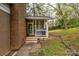 Side view of the porch with wood floors and a brick and stone pathway at 107 Wedgewood Ne Cir, Concord, NC 28025