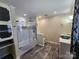 Elegant bathroom featuring a glass-enclosed shower, a decorative sink, and stylish fixtures at 1301 Huckleberry Dr, Lincolnton, NC 28092