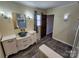 Nicely renovated bathroom featuring a custom vanity with a decorative bowl sink and updated lighting at 1301 Huckleberry Dr, Lincolnton, NC 28092