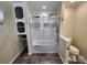 Bathroom with glass enclosed shower, updated tiling, and storage cabinets at 1301 Huckleberry Dr, Lincolnton, NC 28092
