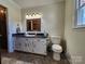 Bathroom with granite countertop, updated vanity, and toilet at 1301 Huckleberry Dr, Lincolnton, NC 28092