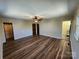 Spacious bedroom with hardwood floors, a ceiling fan, and ensuite bathroom access at 1301 Huckleberry Dr, Lincolnton, NC 28092