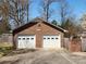 Detached two-car brick garage with white doors and decorative windows, and a well-maintained front yard at 1301 Huckleberry Dr, Lincolnton, NC 28092
