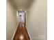 Open hallway with hardwood flooring and neutral colored walls at 1301 Huckleberry Dr, Lincolnton, NC 28092