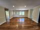 A bright and airy living room features hardwood floors, neutral walls, and ample natural light at 1301 Huckleberry Dr, Lincolnton, NC 28092