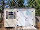 A backyard shed with a window and double doors, providing ample storage space for your outdoor equipment at 1301 Huckleberry Dr, Lincolnton, NC 28092