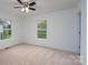 Cozy bedroom with plush carpeting, neutral walls, and great light from the window at 1413 Caldwell St, Gastonia, NC 28052