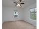 Bright bedroom with a ceiling fan, carpeted floors, and plenty of natural light at 1413 Caldwell St, Gastonia, NC 28052