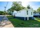 A well-maintained home with vinyl siding and a dark painted foundation near the sidewalk at 1413 Caldwell St, Gastonia, NC 28052