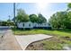 Side view of a home with recent updates including a concrete parking pad at 1413 Caldwell St, Gastonia, NC 28052