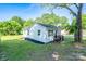 Quaint home with white vinyl siding and black shutters on a well-manicured lawn at 1413 Caldwell St, Gastonia, NC 28052